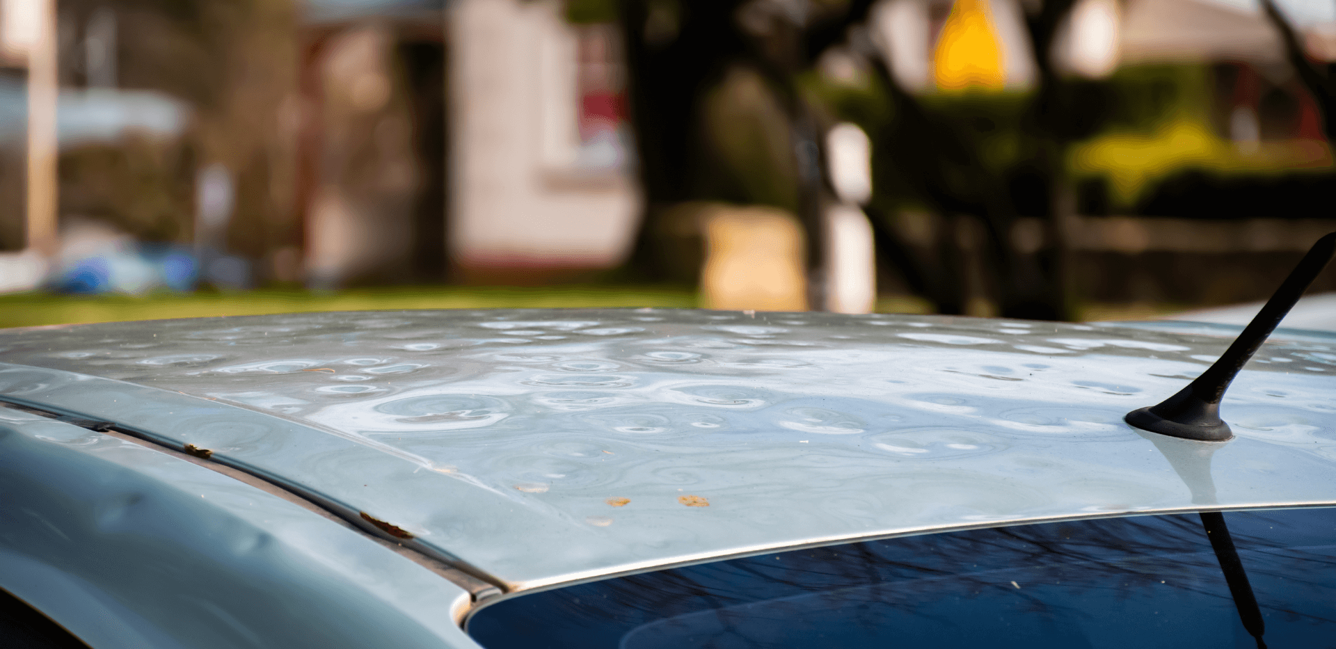 Badly damaged car roof from hailstorm